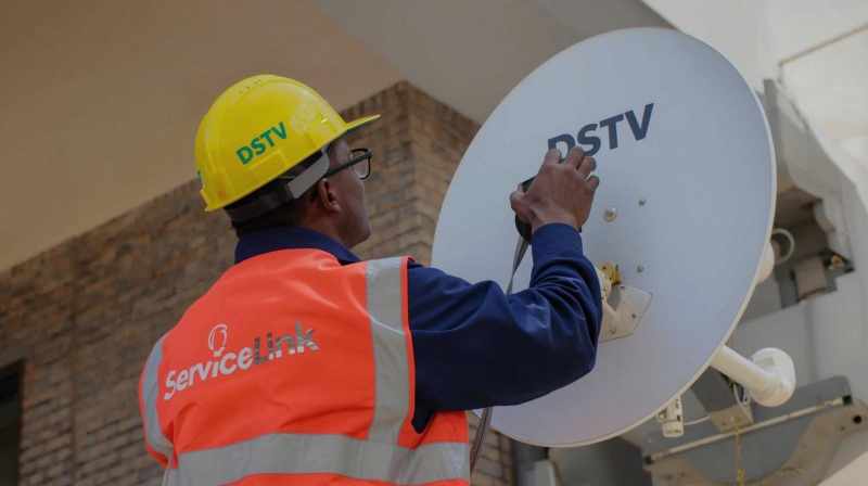 Technician diagnosing common DStv problems